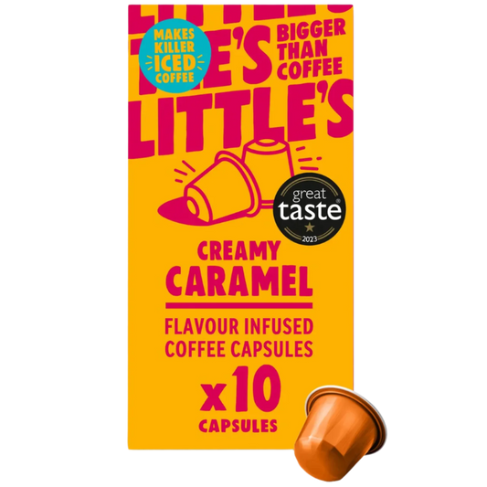 Box of creamy caramel flavored coffee capsules with a single capsule on a white background